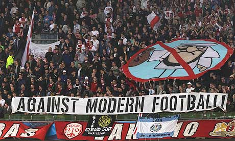 Ajax fans show the banner at the Manchester City game that has led to a 10,000 fine from Uefa